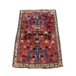 Persian red ground rug