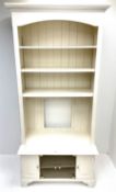 Cream painted bookcase on media stand