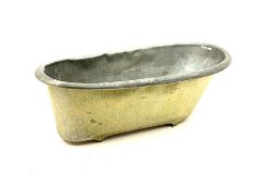 Early 20th century zinc and tin roll top bath tub