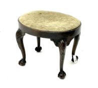 Georgian style walnut stool of oval form with plain frieze and upholstered drop-in seat on four cabr