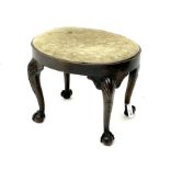 Georgian style walnut stool of oval form with plain frieze and upholstered drop-in seat on four cabr