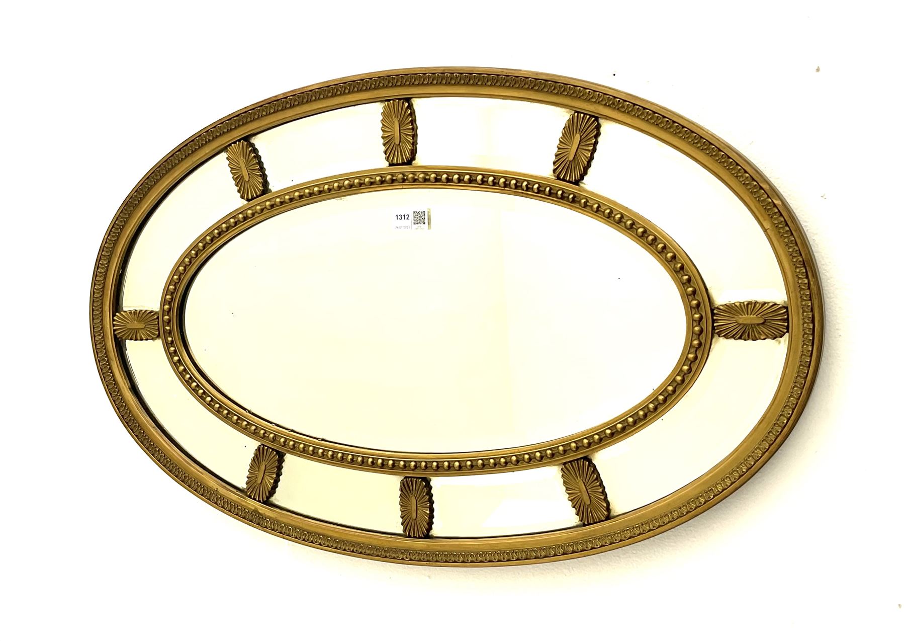 Adam�s style oval gilt framed wall mirror