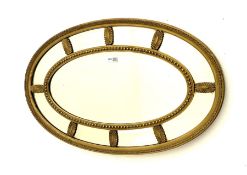 Adam�s style oval gilt framed wall mirror