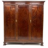 Early 20th century mahogany seven piece bedroom suite - triple wardrobe with projecting cornice of f