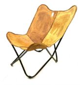 Elephant embossed sling chair upholstered in brown leather