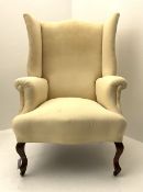 Early 20th century beech framed wingback armchair