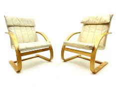 Pair lightwood cantilever easy chairs upholstered in cream leather