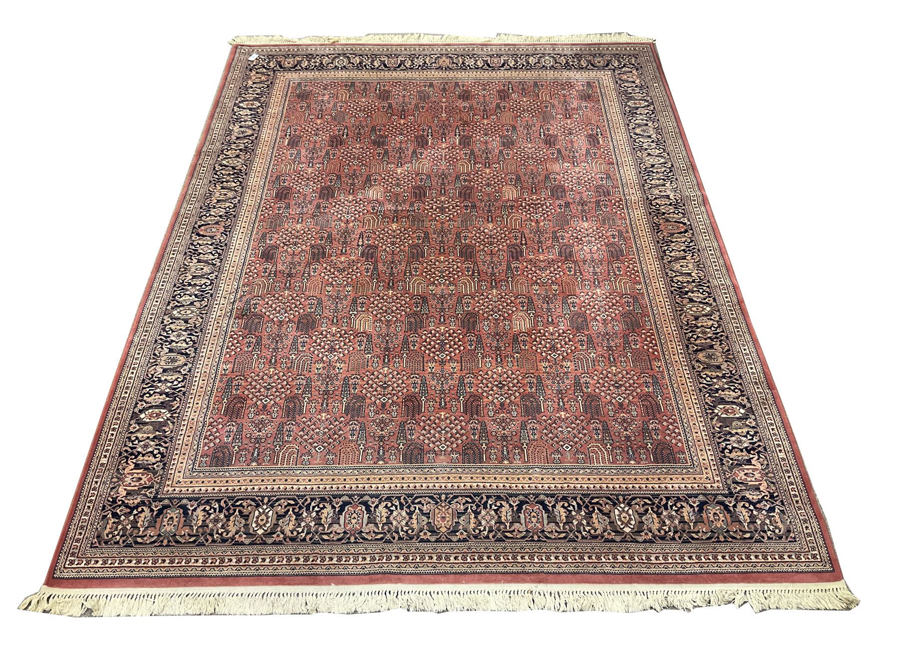 Large Persian design red ground carpet