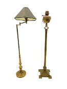 Early 19th century brass Corinthian column floor standing oil lamp and a brass adjustable standard l