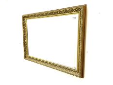 Rectangular ribbed gilt framed bevelled edge wall mirror and a rectangular wall mirror in swag frame