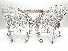 White painted scrolled wirework garden table (D77cm