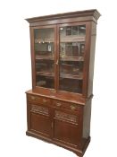 Late Victorian mahogany glazed bookcase on cupboard