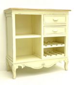 Cream painted side cabinet fitted with drawers and bottle rack