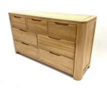 Light oak chest fitted with three short drawers above four long drawers