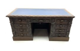 Victorian heavily carved oak twin pedestal desk