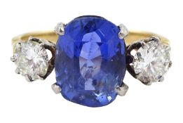 Gold three stone oval sapphire and round brilliant cut diamond ring