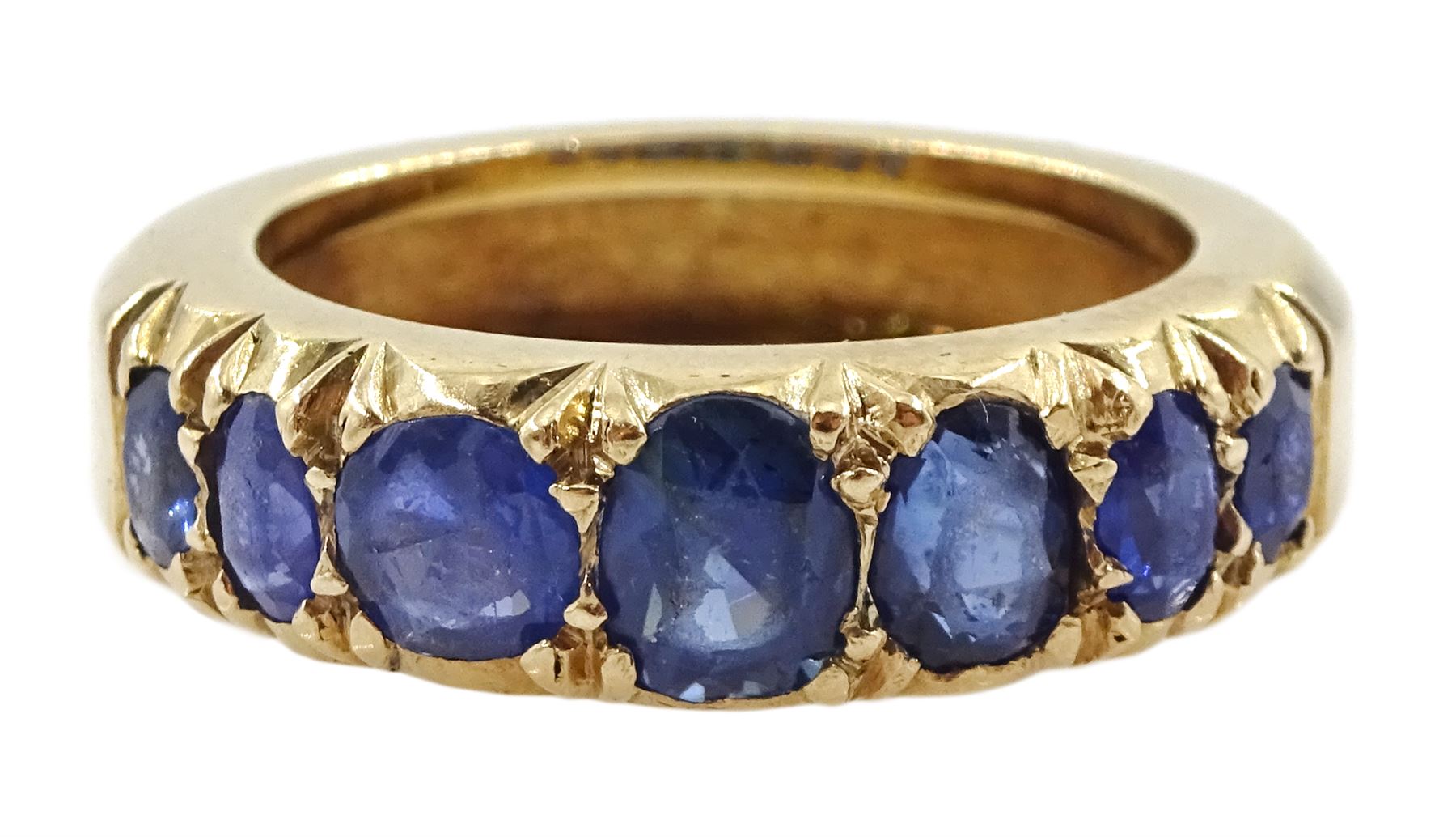 Gold graduating seven stone vari-cut sapphire ring