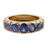 Gold graduating seven stone vari-cut sapphire ring