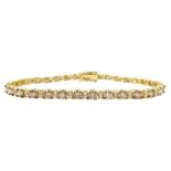 Gold round brilliant cut diamond champagne and white diamond bracelet