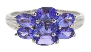 White gold seven stone oval tanzanite cluster ring