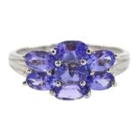 White gold seven stone oval tanzanite cluster ring