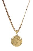 Gold circular locket with engraved decoration