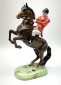 A Beswick model of a huntsman on rearing horse