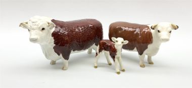 A Beswick Hereford family group