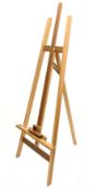 A pine floor standing artists easel