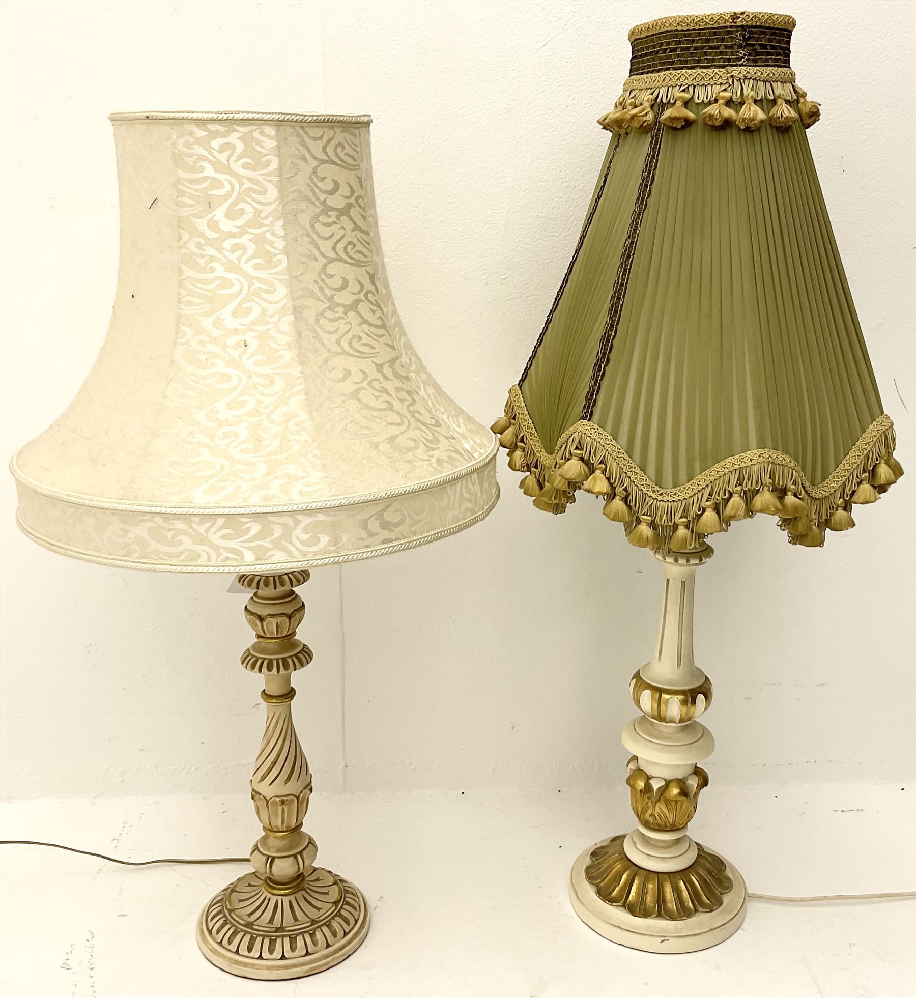 A cream and gilt finished table lamp