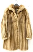 Ladies full length light brown mink fur coat.