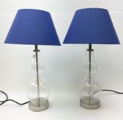Pair of double gourd shaped clear glass table lamps with blue shades H55cm.