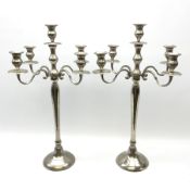 Large pair of alloy metal four branch table candelabras with scroll decoration H67cm.