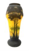 Reproduction Daum Nancy art nouveau style overlay and cut glass vase decorated with woodland and a