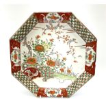 Japanese octagonal charger enamelled to the centre with flowers and blossom within a border of alter