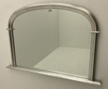 Arch top overmantle mirror in silver frame