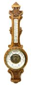 Early 20th century carved oak card aneroid barometer with visible aneroid and mercury thermometer