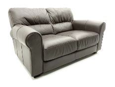 Three seat sofa and matching two seater upholstered in brown leather