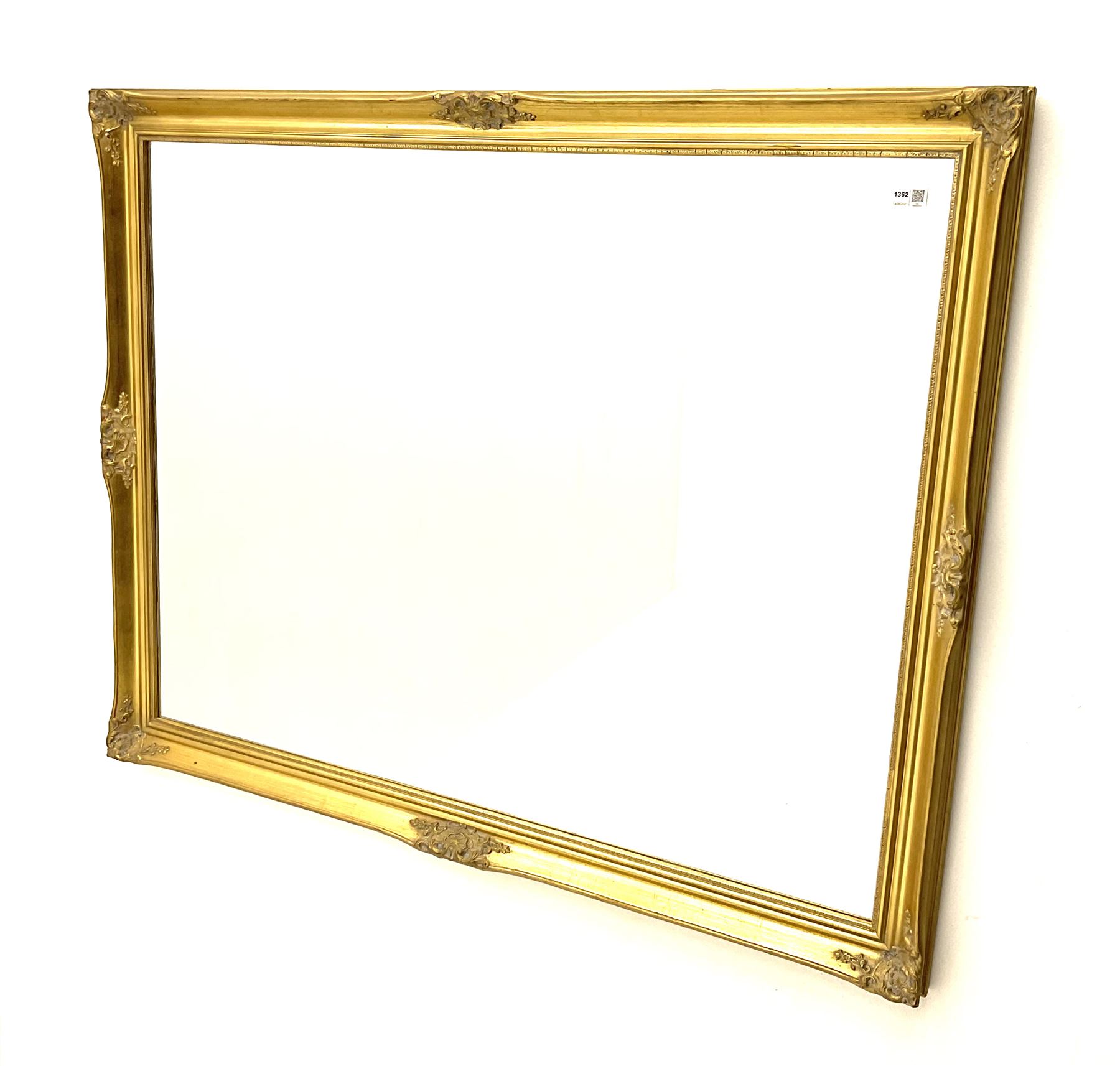 Large wall mirror in gilt swept frame
