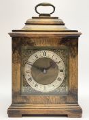 Small late 20th century walnut cased bracket clock. sarcophagus top with brass loop handle