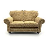 Alstons two seat sofa upholstered in beige patterned fabric