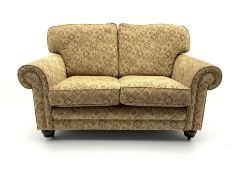 Alstons two seat sofa upholstered in beige patterned fabric