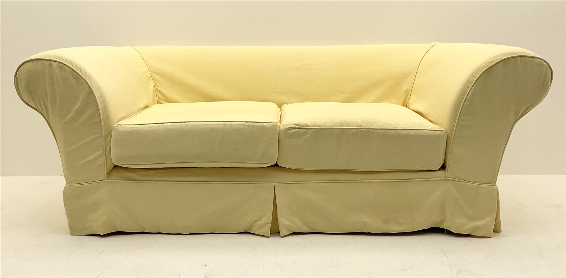 Pair traditional two seat sofas upholstered in pale yellow cover