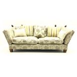 Grande Knole drop arm three seat sofa upholstered in pale fabric with raised floral pattern