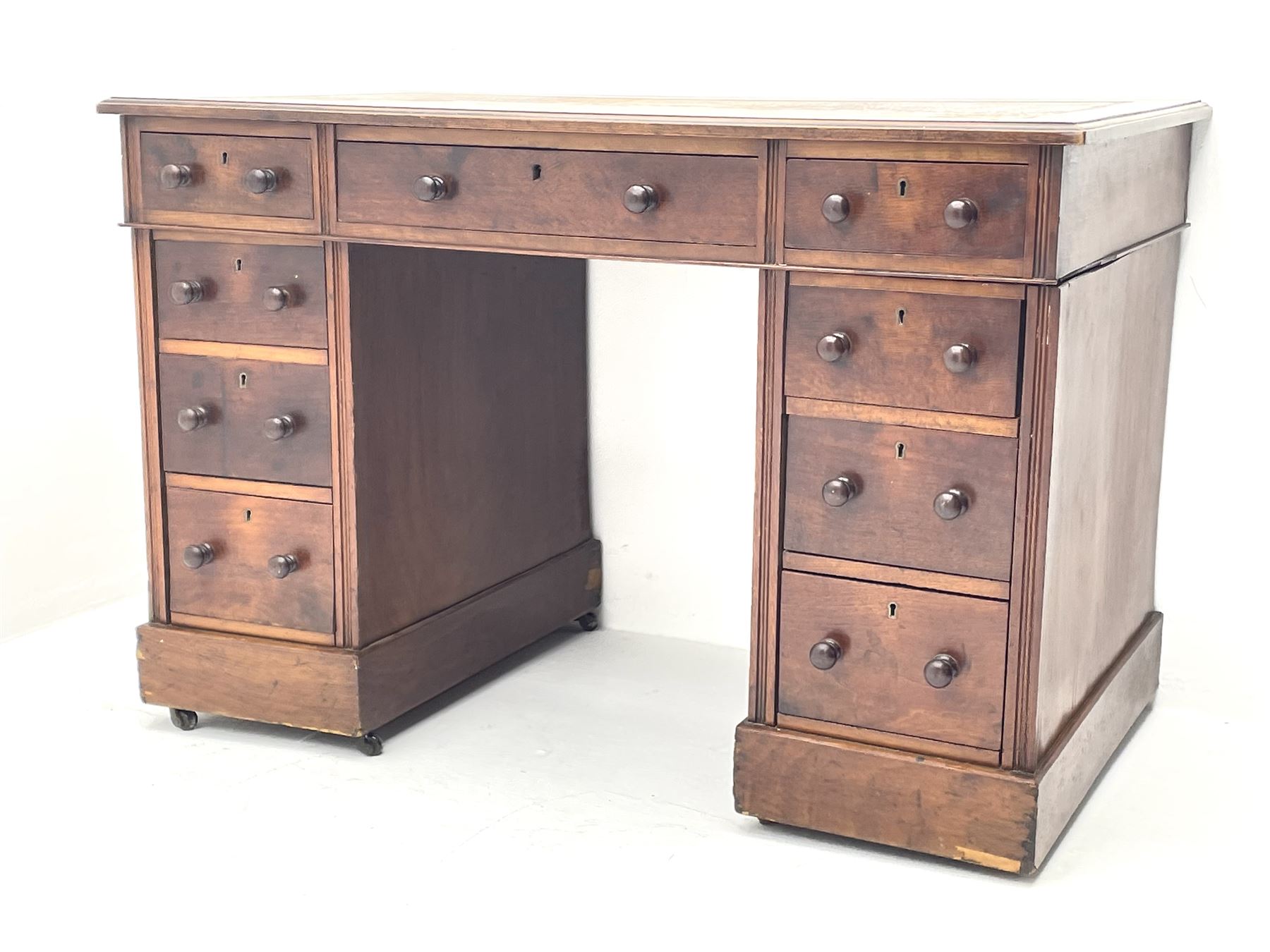 Late Victorian walnut twin pedestal desk of small proportions