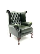 Georgian style wing back armchair upholstered in green buttoned leather
