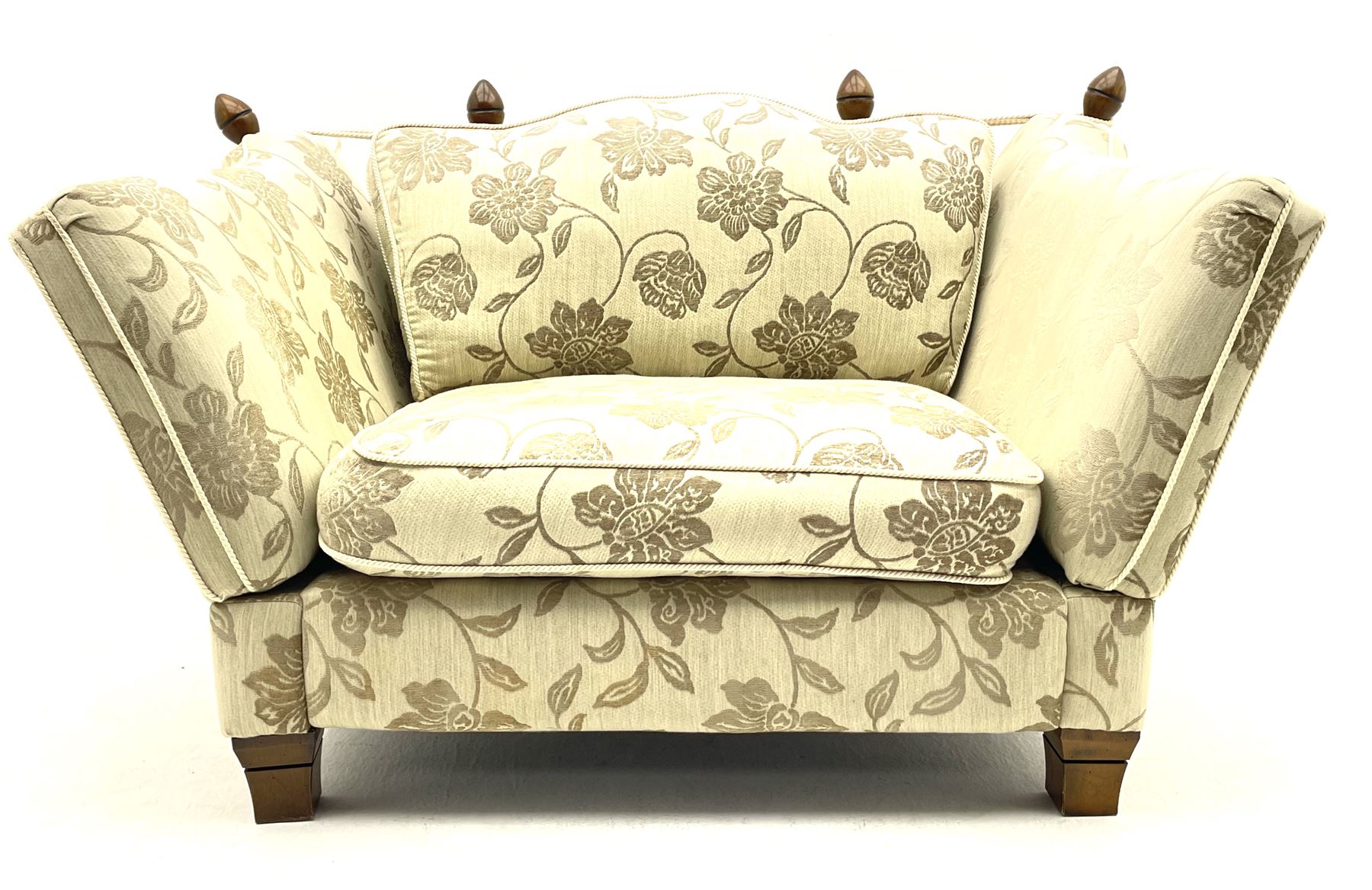 Knole �Snuggler� drop arm sofa upholstered in pale fabric with raised floral pattern