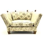 Knole �Snuggler� drop arm sofa upholstered in pale fabric with raised floral pattern