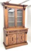 Late Victorian walnut bookcase on cupboard