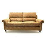 Duresta two seat sofa upholstered in a dark beige floral patterned fabric